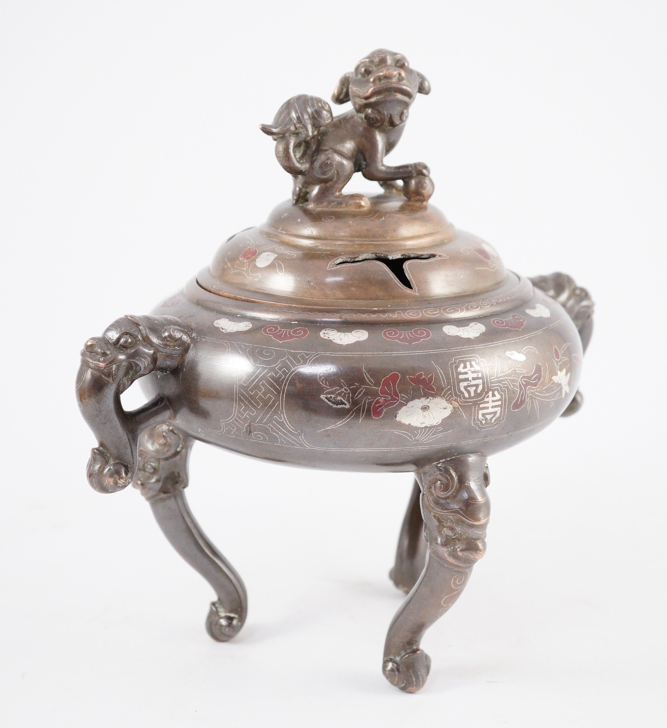 A Vietnamese silver inlaid bronze tripod censer and cover, 19th century, 24cm high, 24cm wide